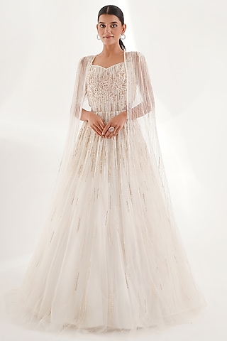 White Glitter Net Sequins & Cutdana Embellished Gown With Cape by Chaashni by Maansi and Ketan