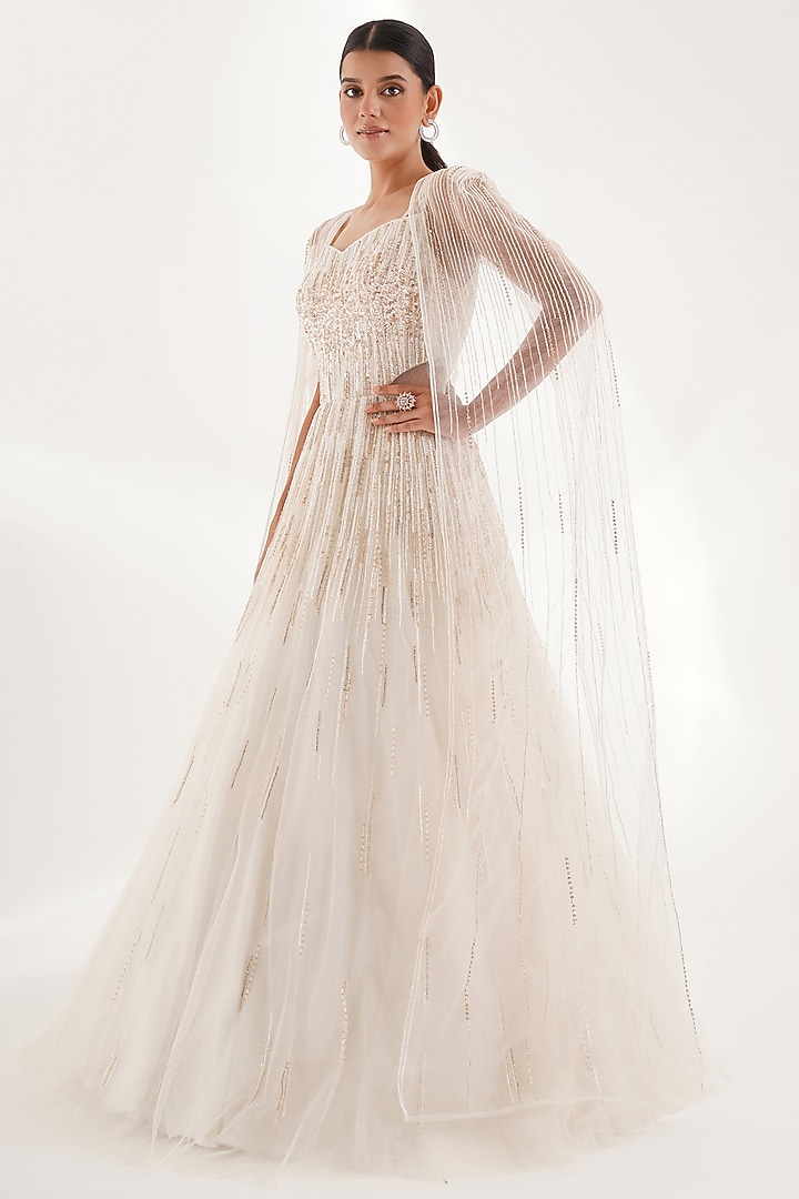 White Glitter Net Sequins & Cutdana Embellished Engagement Gown With Cape by Chaashni by Maansi and Ketan at Pernia's Pop Up Shop