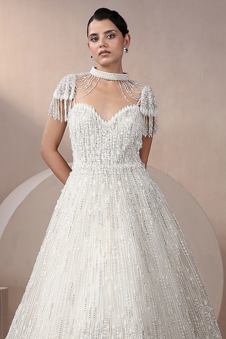 Off-White Net Pearl Embellished Wedding Gown With Cape by Chaashni by Maansi and Ketan at Pernia's Pop Up Shop
