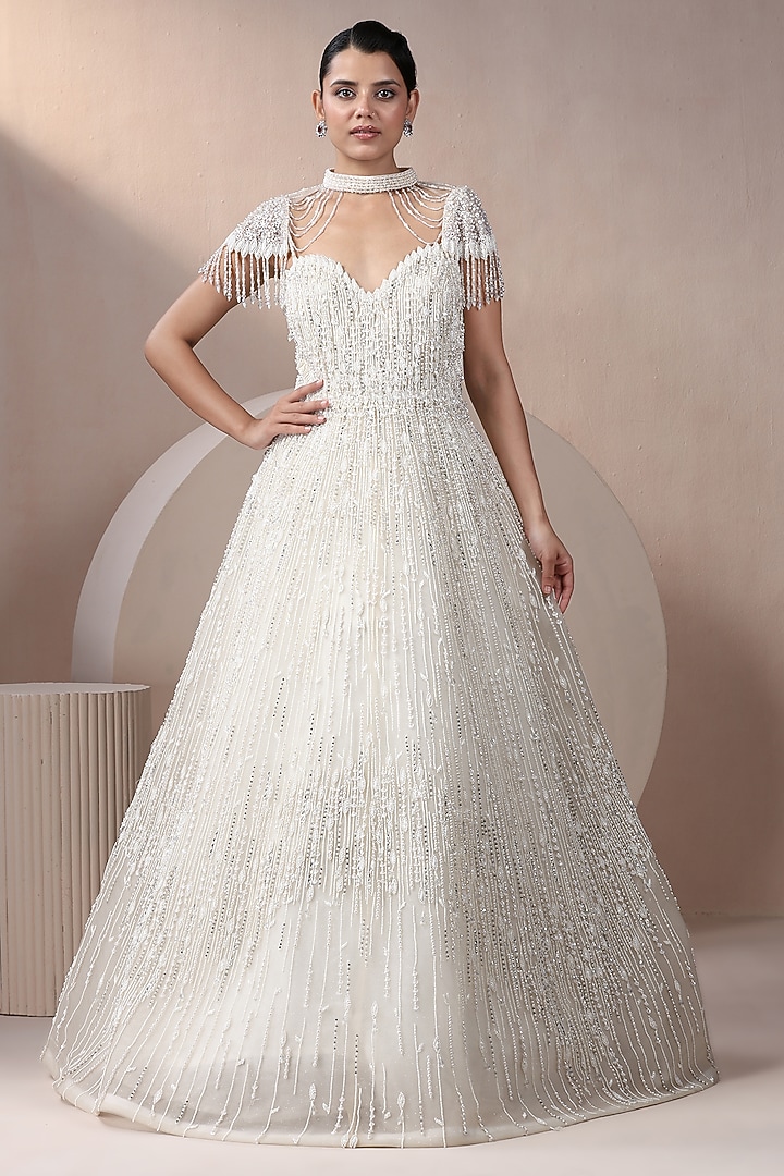 Off-White Net Pearl Embellished Wedding Gown With Cape by Chaashni by Maansi and Ketan at Pernia's Pop Up Shop