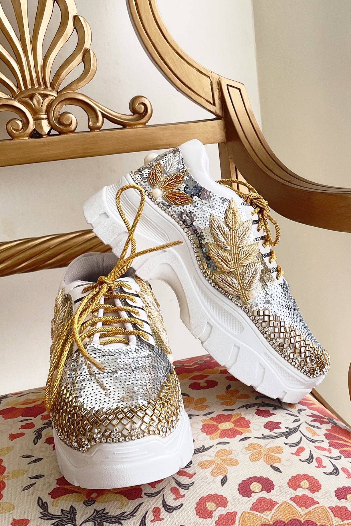 Premium AI Image  a pair of gold shoes with sparkles on them