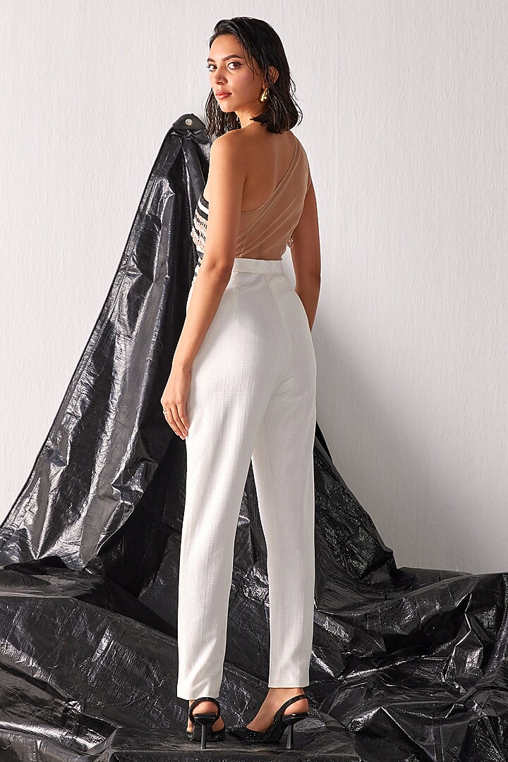 White Textured Fabric Tassel Embroidered Jumpsuit by CP by Chandini and Priyanka at Pernia's Pop Up Shop