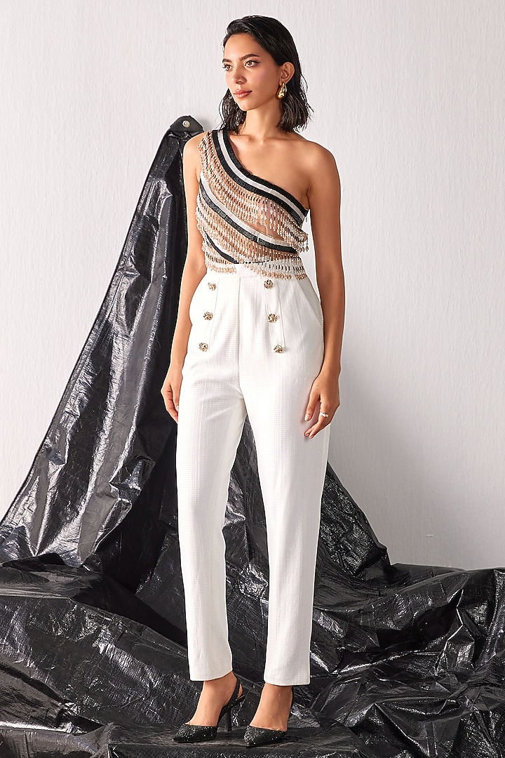 White Textured Fabric Tassel Embroidered Jumpsuit by CP by Chandini and Priyanka at Pernia's Pop Up Shop