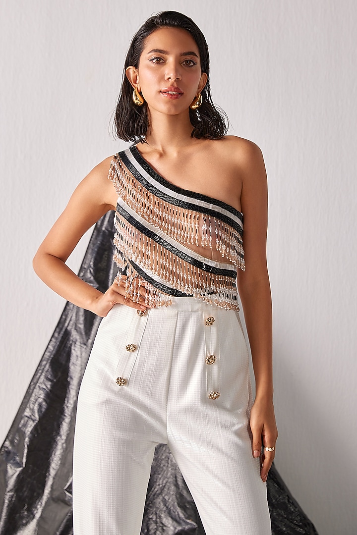 White Textured Fabric Tassel Embroidered Jumpsuit by CP by Chandini and Priyanka at Pernia's Pop Up Shop