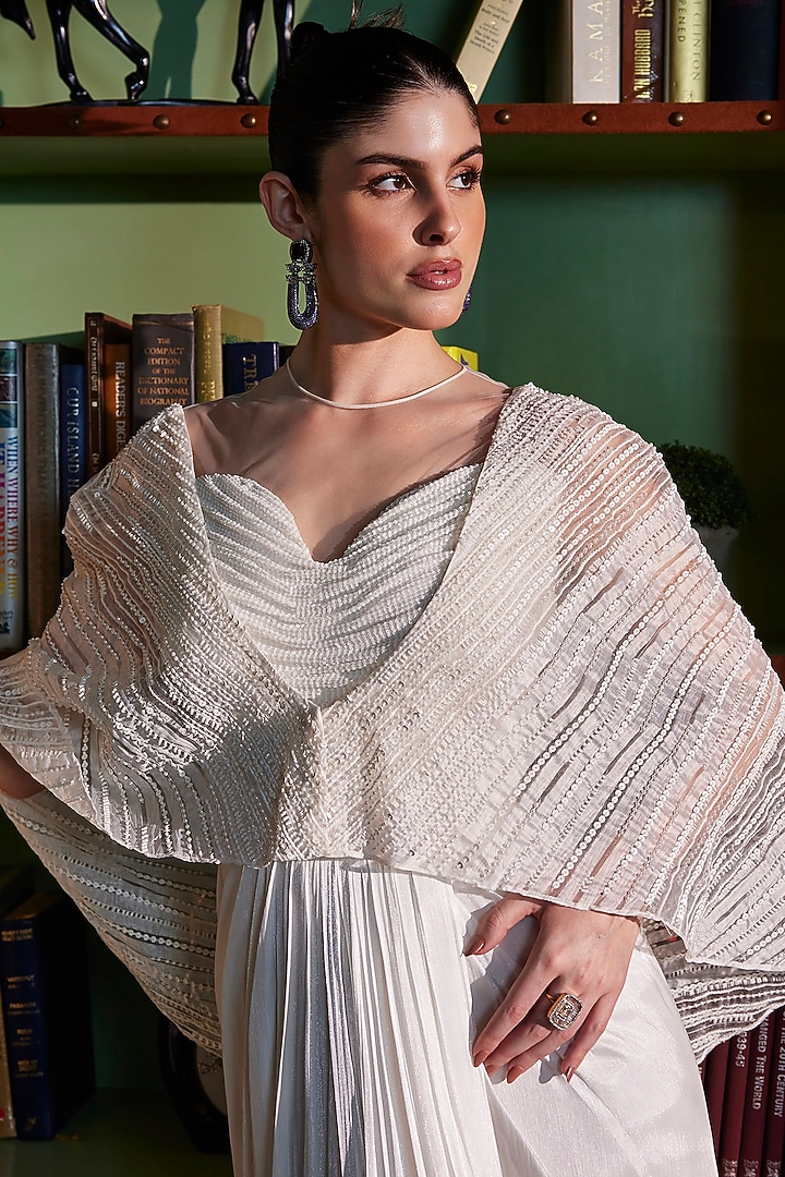 Ivory Metallic Satin & Crinkled Organza Draped Wedding Gown Saree With Cape by CP by Chandini and Priyanka at Pernia's Pop Up Shop