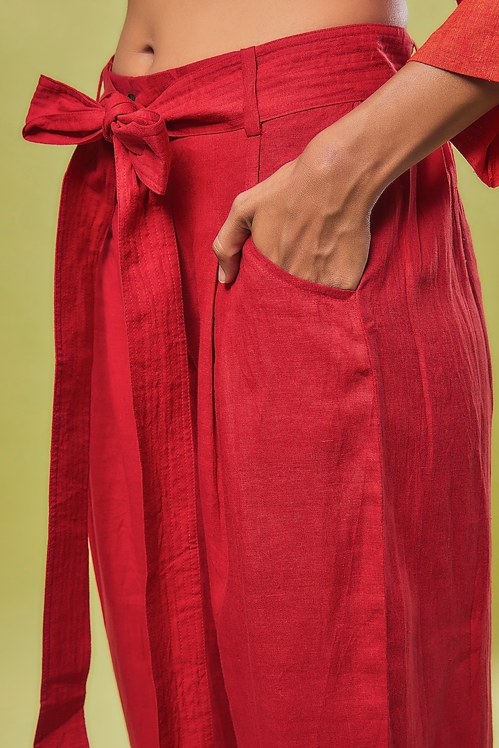 Red Linen Pleated Trousers by Chola at Pernia's Pop Up Shop