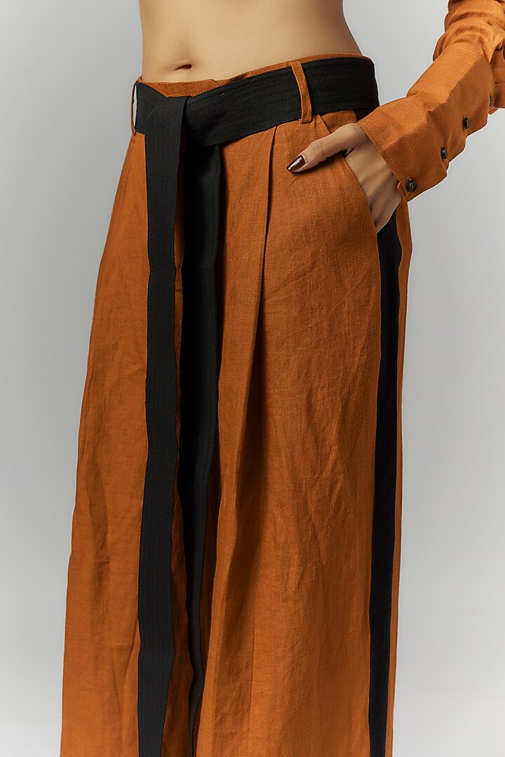 Rust Linen Pleated Trousers by Chola at Pernia's Pop Up Shop