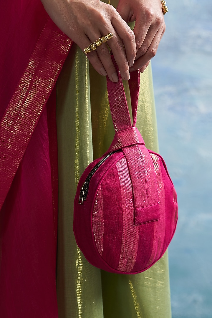 Fuchsia Pink Linen & Cotton Shimmer Round Potli Bag by Charkhee Accessories at Pernia's Pop Up Shop