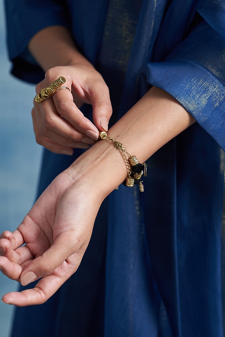 Gold Finish Aura Chimes Bracelet by Charkhee Accessories at Pernia's Pop Up Shop