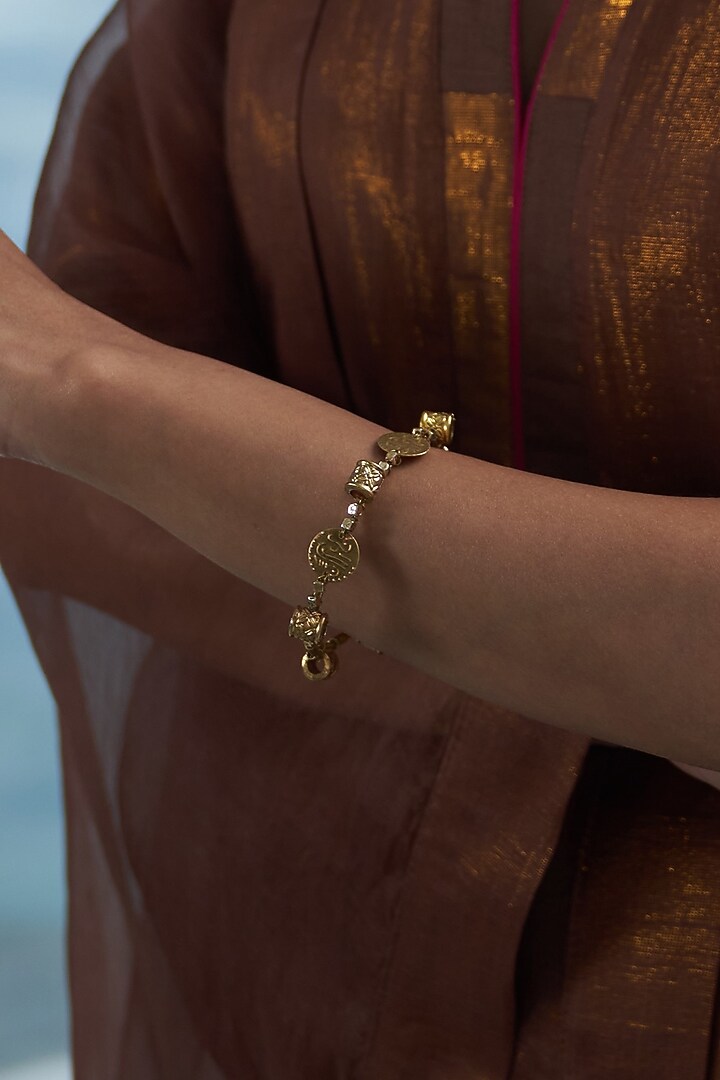 Gold Finish Aura Bangle by Charkhee Accessories at Pernia's Pop Up Shop