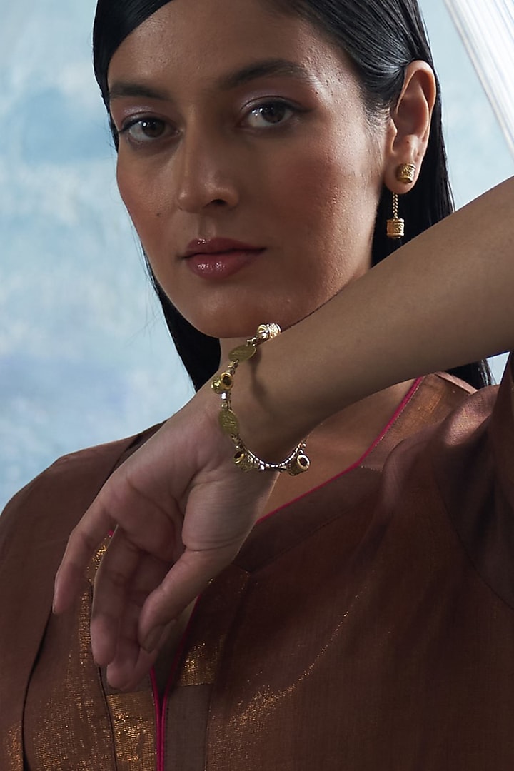 Gold Finish Aura Bangle by Charkhee Accessories at Pernia's Pop Up Shop