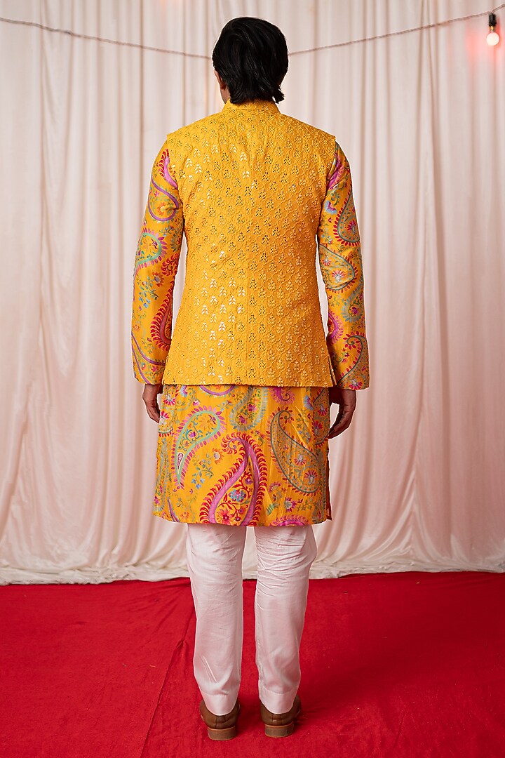 Yellow Chanderi Silk & Cotton Satin Mirror Work Bundi Jacket Set by chrkha men at Pernia's Pop Up Shop