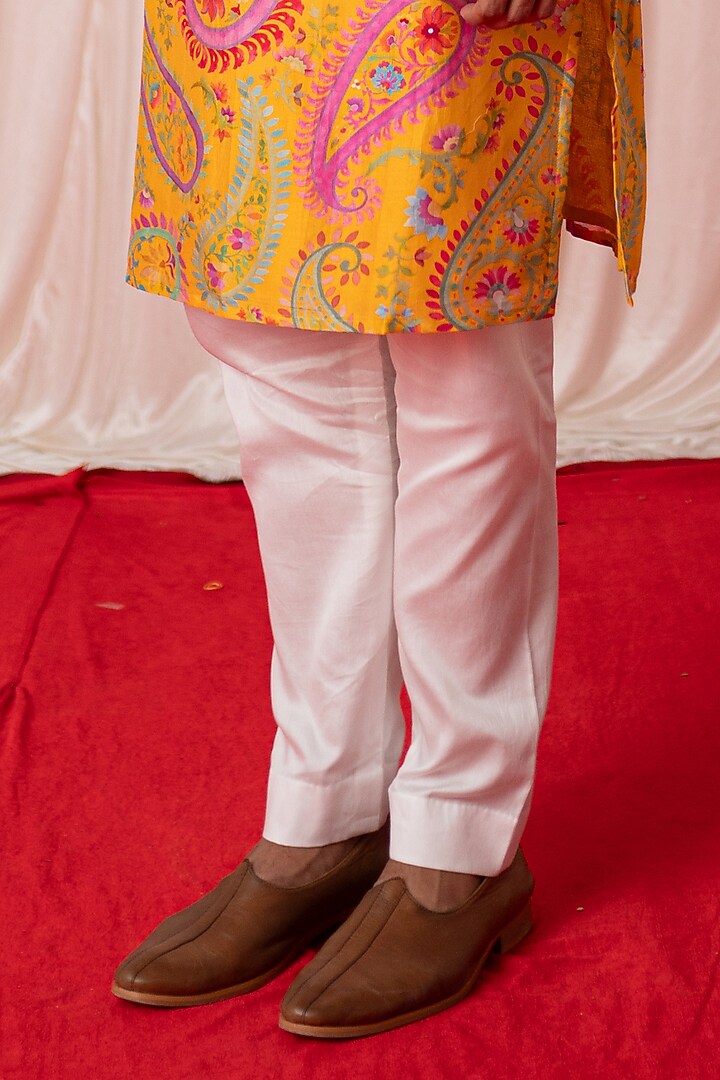 Yellow Chanderi Silk & Cotton Satin Mirror Work Bundi Jacket Set by chrkha men at Pernia's Pop Up Shop