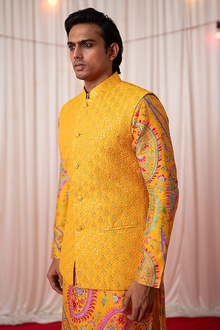 Yellow Chanderi Silk & Cotton Satin Mirror Work Bundi Jacket Set by chrkha men at Pernia's Pop Up Shop