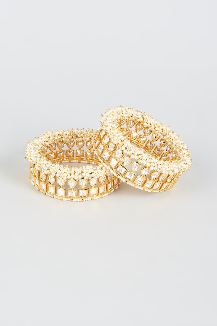 Gold Finish Moti & Kundan Polki Bangles (Set of 2) by CHAOTIQ BY ARTI at Pernia's Pop Up Shop