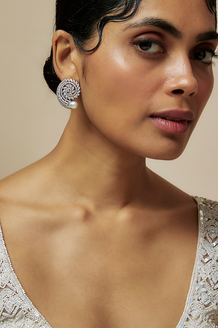 White Rhodium Finish American Diamond Stud Earrings by CHAOTIQ BY ARTI