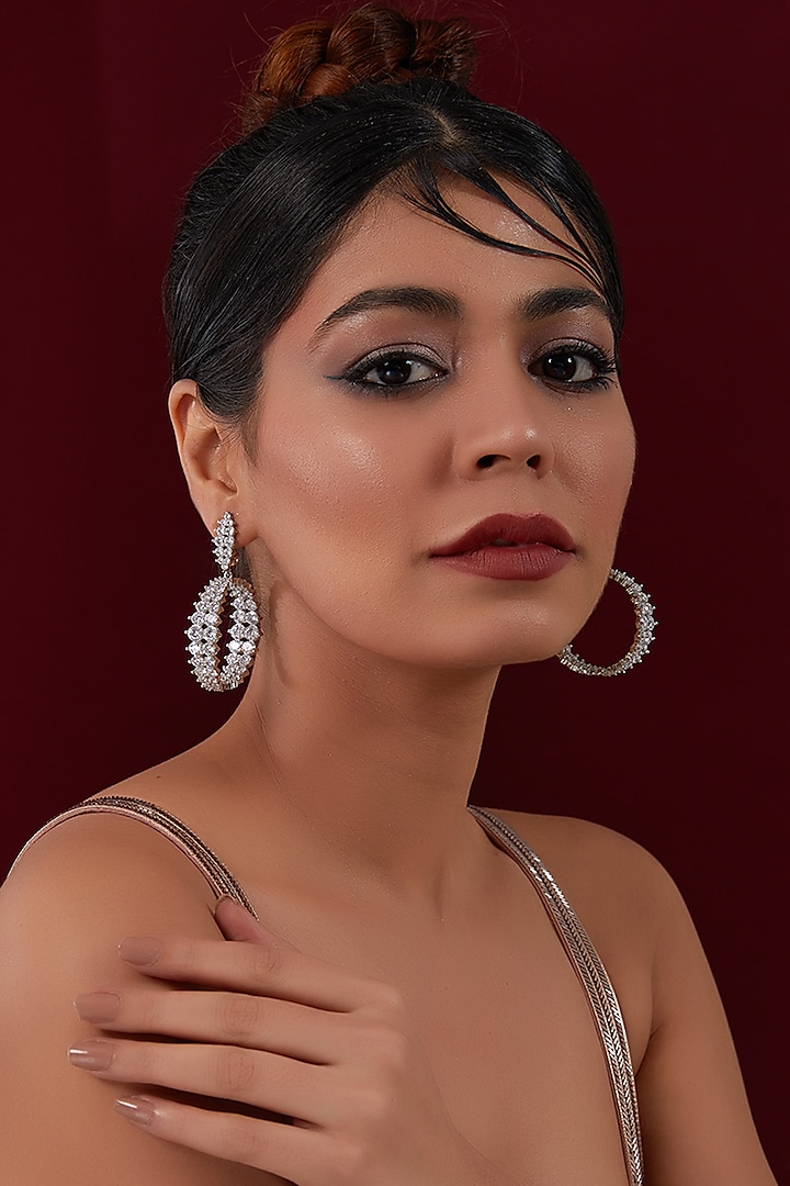 White Rhodium Finish American Diamond Dangler Earrings by CHAOTIQ BY ARTI at Pernia's Pop Up Shop