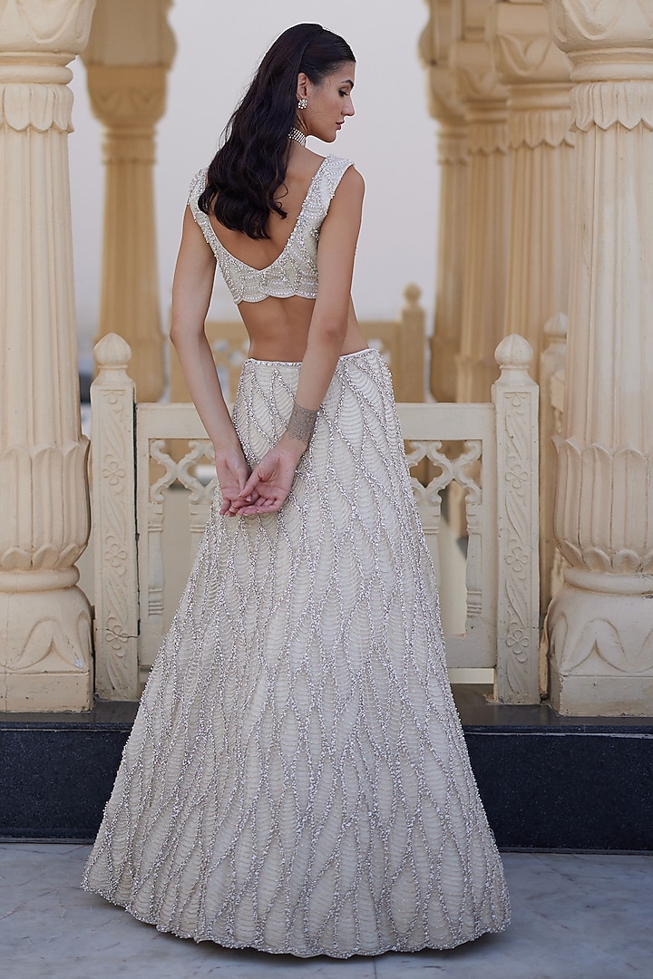 Ivory Net Wave Embroidered Bridal Lehenga Set by Charu & Vasundhara at Pernia's Pop Up Shop