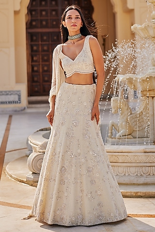 Ivory Net Floral Embroidered Lehenga Set by Charu & Vasundhara