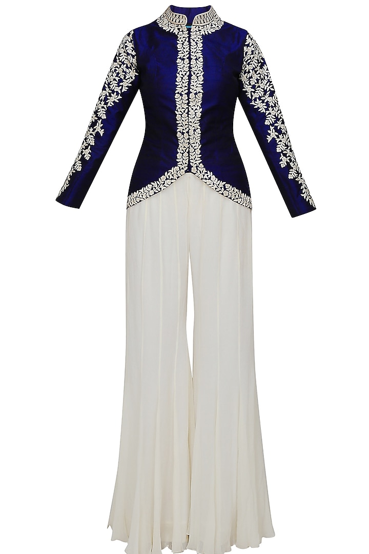 Blue floral embroidered jacket and white sharara set by Chhavvi Aggarwal