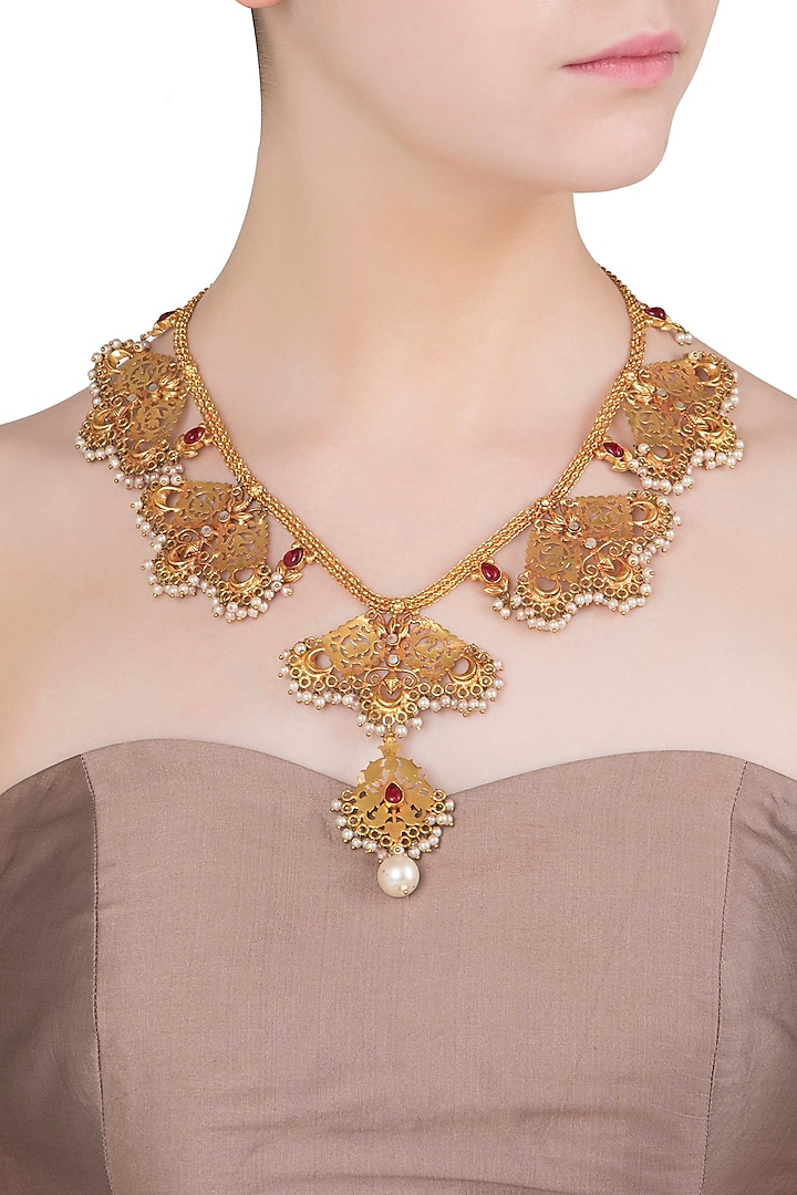 Gold Finish Red Stone and Pearls Textured Motif Necklace by Chhavi's Jewels