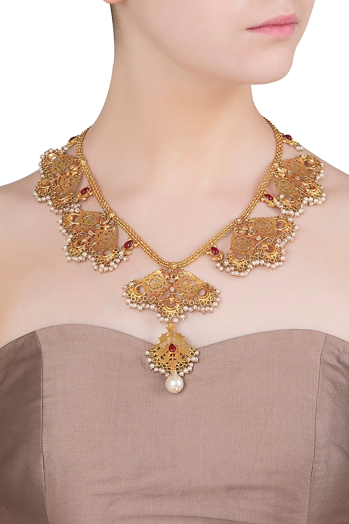Gold finish red stone and pearls textured motif necklace available only at Pernia's Pop Up Shop.