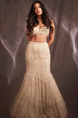 Ivory Net 3D Floral Embellished Lehenga Set by Charu & Vasundhara