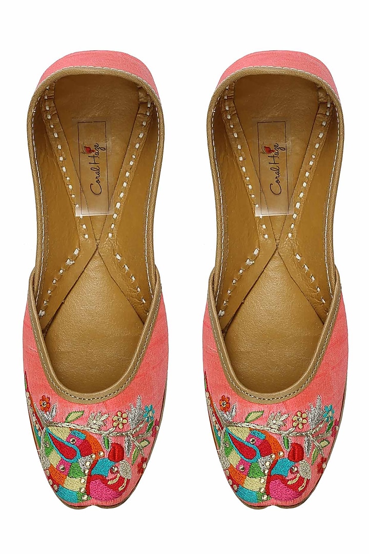 Bright pink thread embroidered parrot motifs juttis by Coral Haze