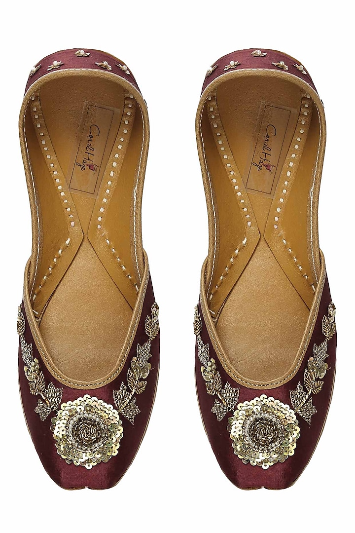 Deep maroon and gold floral zardozi embroidered juttis by Coral Haze