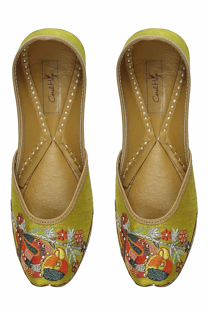 Yellowish green thread embroidered parrot motifs juttis by Coral Haze