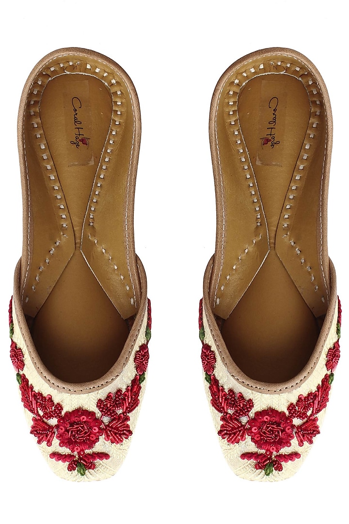 Light gold and red floral embroidered juttis by Coral Haze