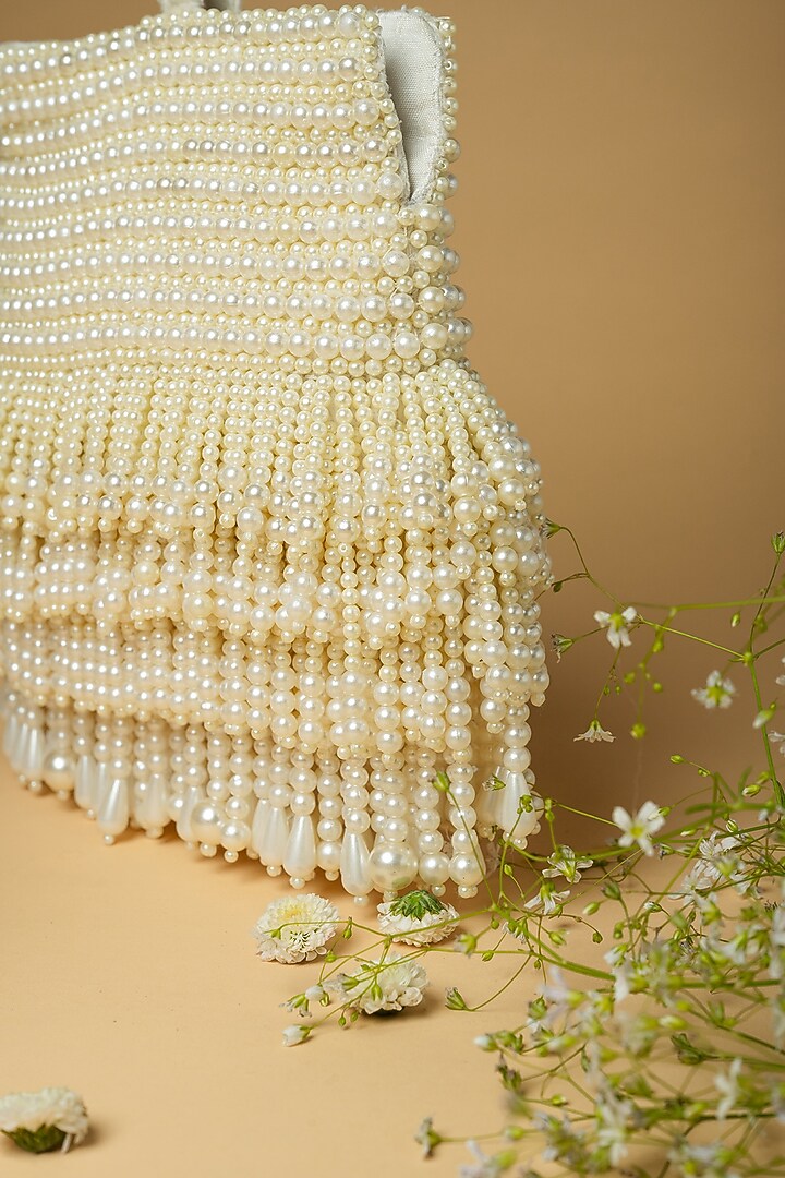 Ivory Cotton Silk Pearl Embellished Bag by Clutch'D at Pernia's Pop Up Shop