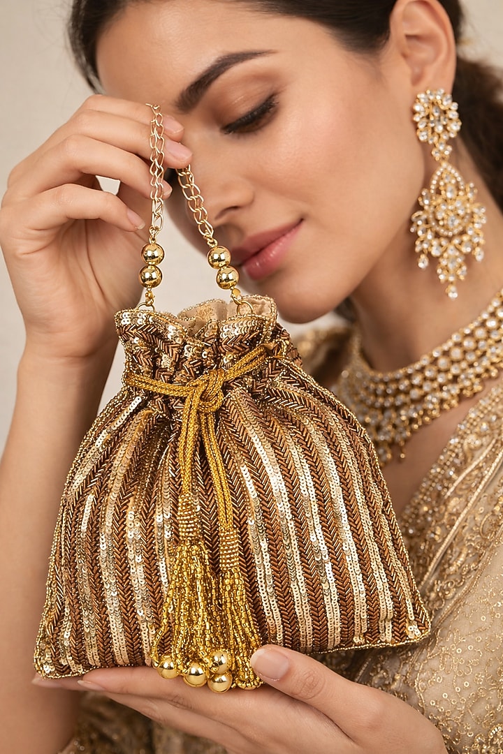 Antique Gold Silk Hand Embroidered Potli by A Clutch Story at Pernia's Pop Up Shop