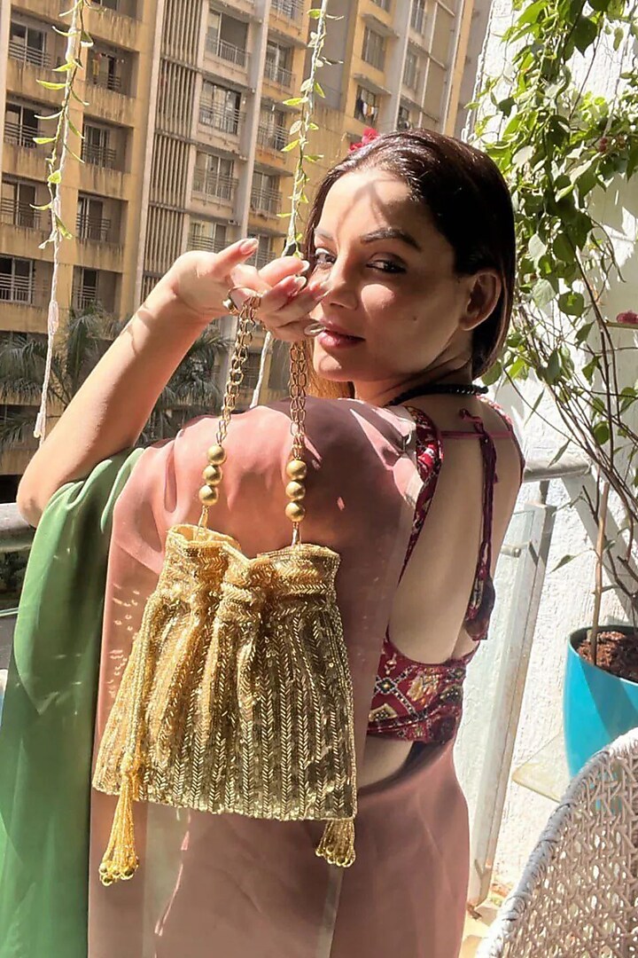 Gold Silk Sequins Hand Embroidered Potli by A Clutch Story at Pernia's Pop Up Shop
