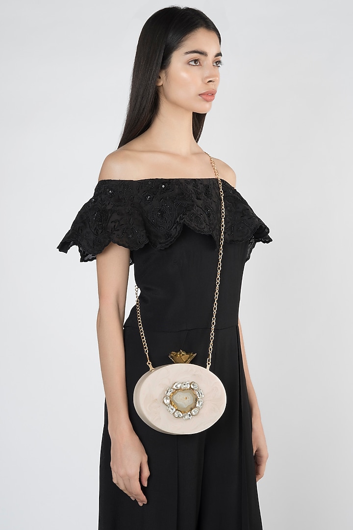 Beige Embellished Oval Clutch by A Clutch Story at Pernia's Pop Up Shop