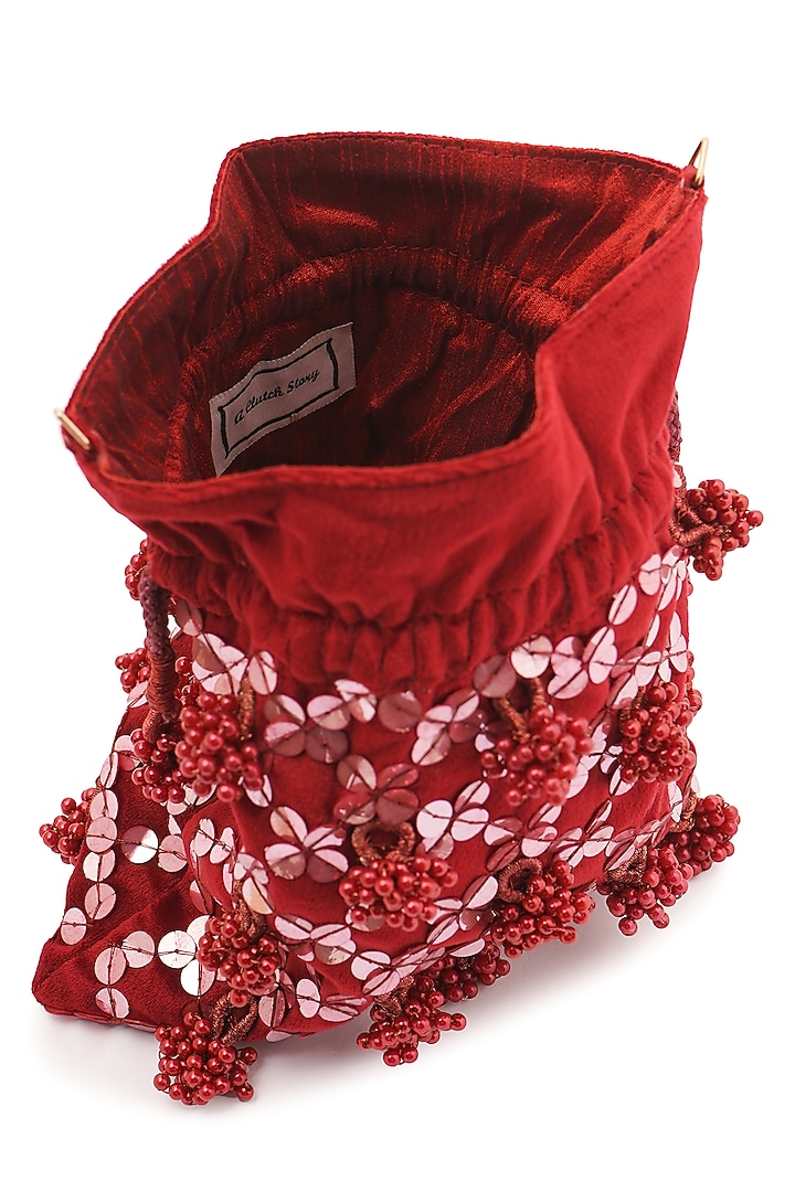 Maroon Suede Sequins Hand Embroidered Potli by A Clutch Story at Pernia's Pop Up Shop