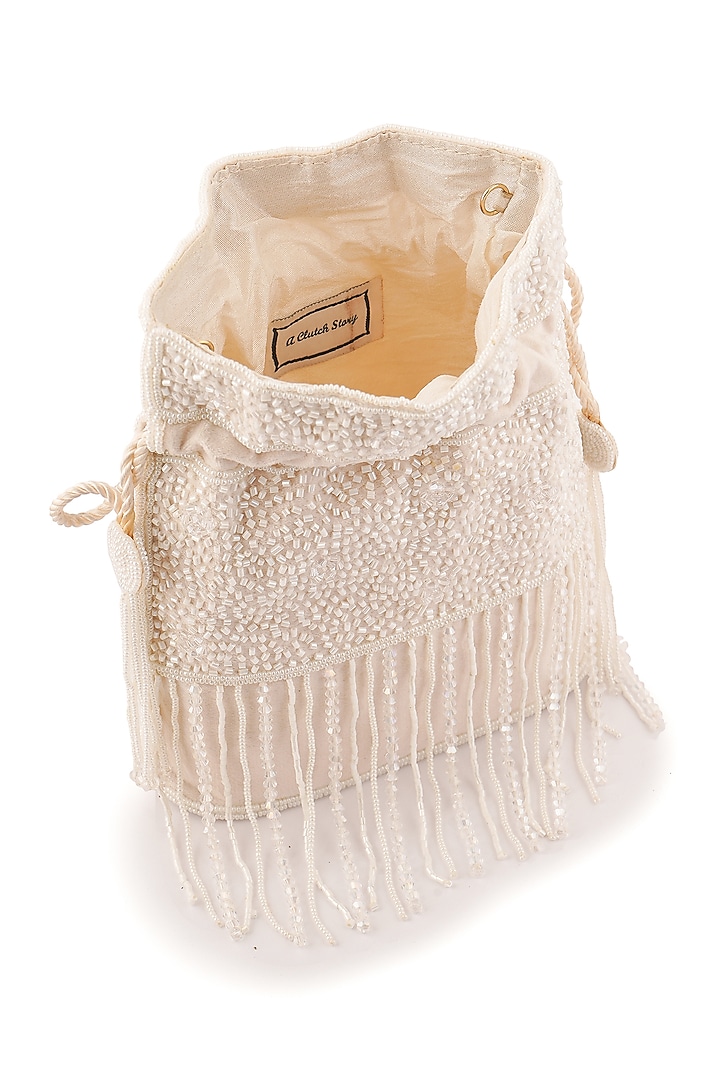 Ivory Suede Beads Hand Embroidered Potli by A Clutch Story at Pernia's Pop Up Shop