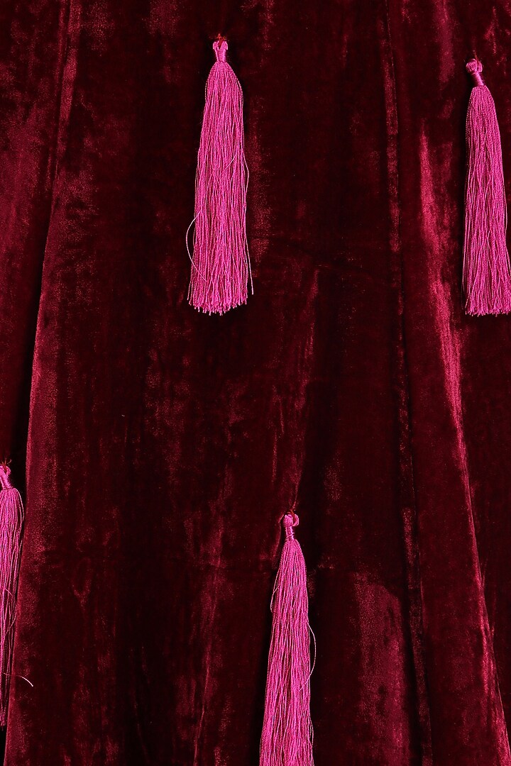 Burgundy tasseled lehenga with flared blouse and jacket set available only at Pernia's Pop Up Shop.