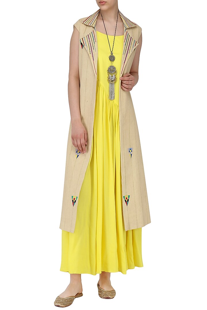 Yellow pleated maxi with beige embroidered jacket available only at Pernia's Pop Up Shop.