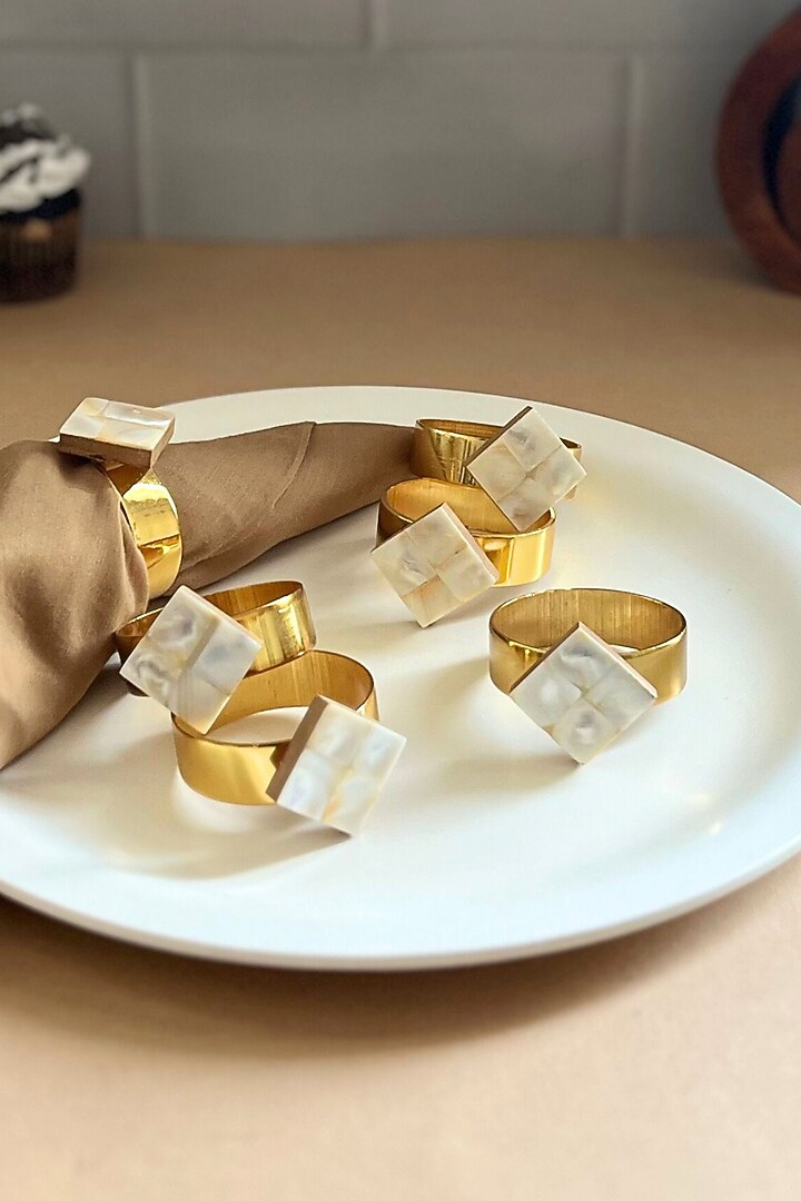 White Mother Of Pearl Diamond-Shaped Napkin Rings (Set Of 6) by Home Jewels by Cotton Indya at Pernia's Pop Up Shop