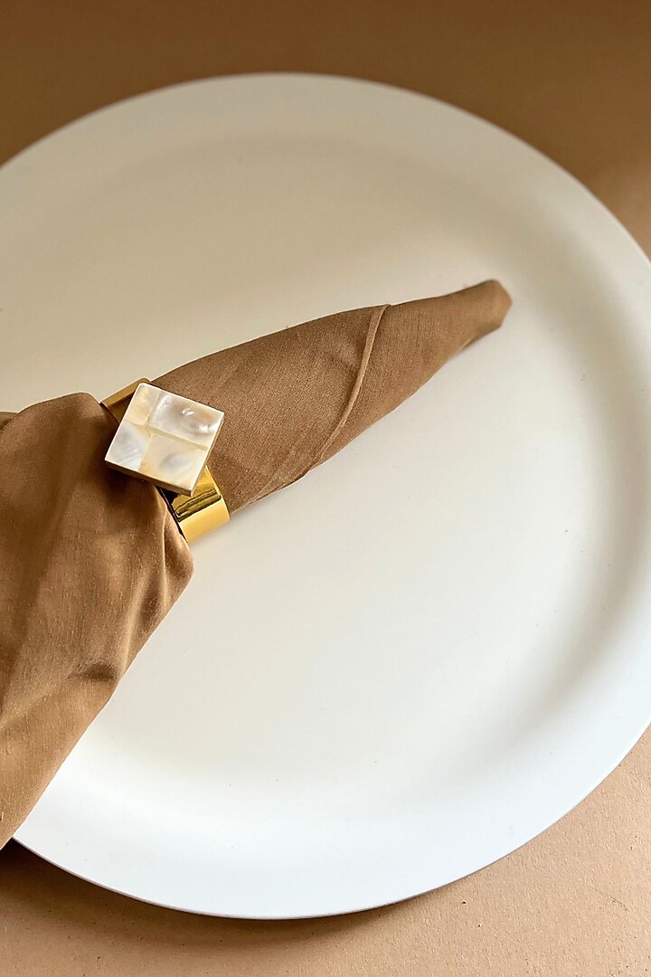 White Mother Of Pearl Diamond-Shaped Napkin Rings (Set Of 6) by Home Jewels by Cotton Indya at Pernia's Pop Up Shop