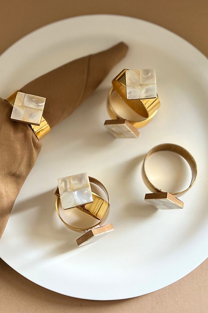 White Mother Of Pearl Diamond-Shaped Napkin Rings (Set Of 6) by Home Jewels by Cotton Indya at Pernia's Pop Up Shop