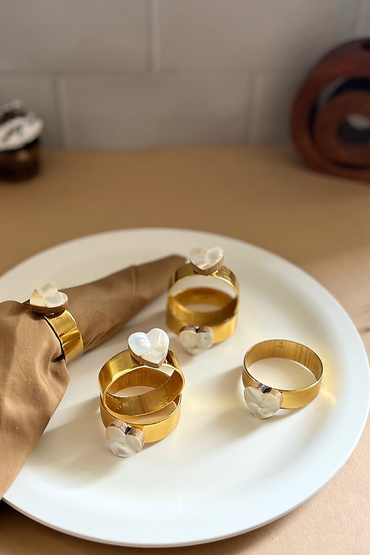 White Mother Of Pearl Heart-Shaped Napkin Rings (Set Of 6) by Home Jewels by Cotton Indya at Pernia's Pop Up Shop