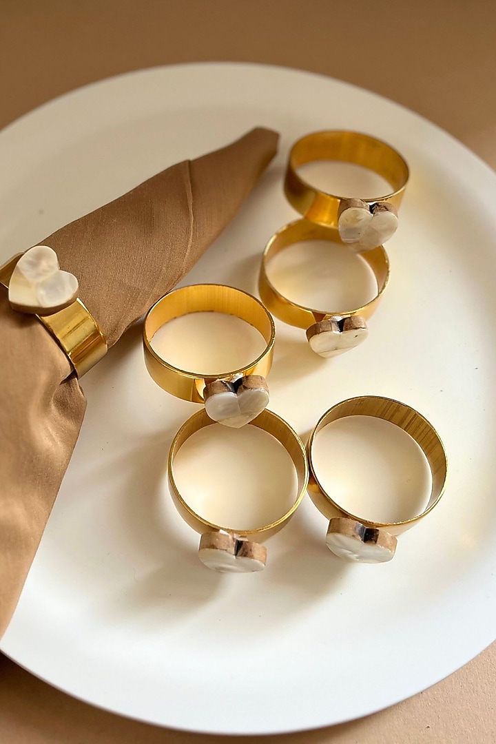 White Mother Of Pearl Heart-Shaped Napkin Rings (Set Of 6) by Home Jewels by Cotton Indya at Pernia's Pop Up Shop