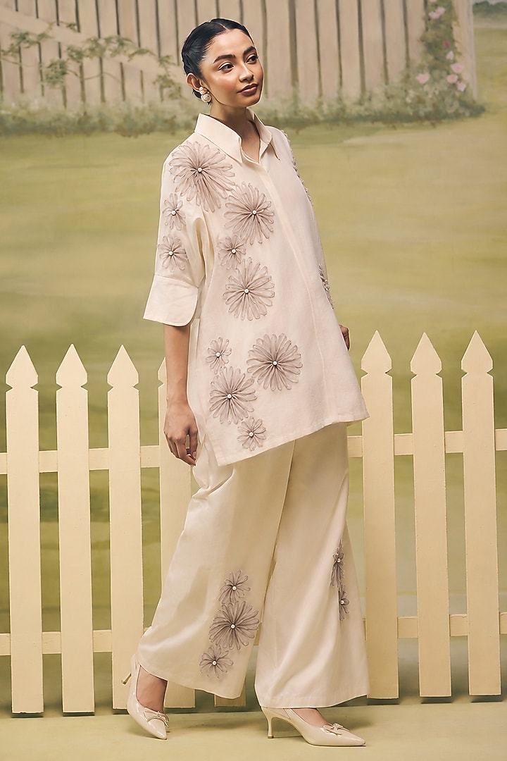 Cream & Dull Mauve Mulmul Chanderi Applique Embroidered Co-Ord Set by Couche at Pernia's Pop Up Shop