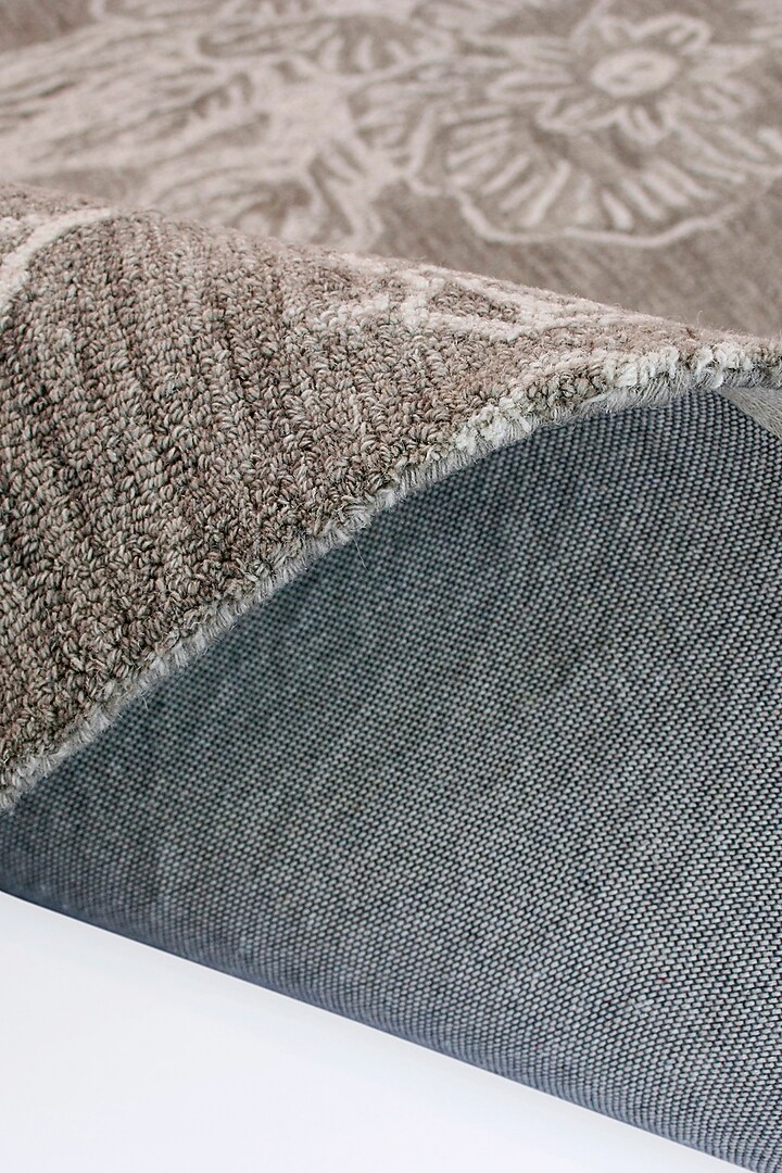 Beige Hand-Tufted Rug With Monochromatic Floral Motifs by The blue knot at Pernia's Pop Up Shop