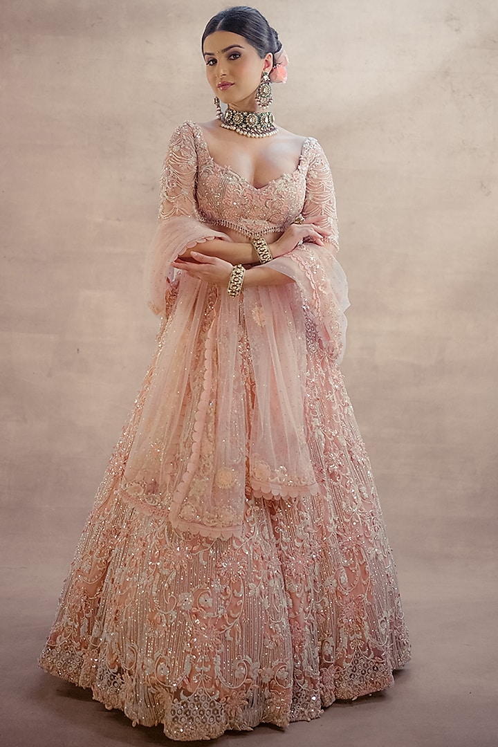 Rose Pink Net 3D Floral Embroidered Bridal Lehenga Set by AWIGNA BY VARSHA & RITTU at Pernia's Pop Up Shop