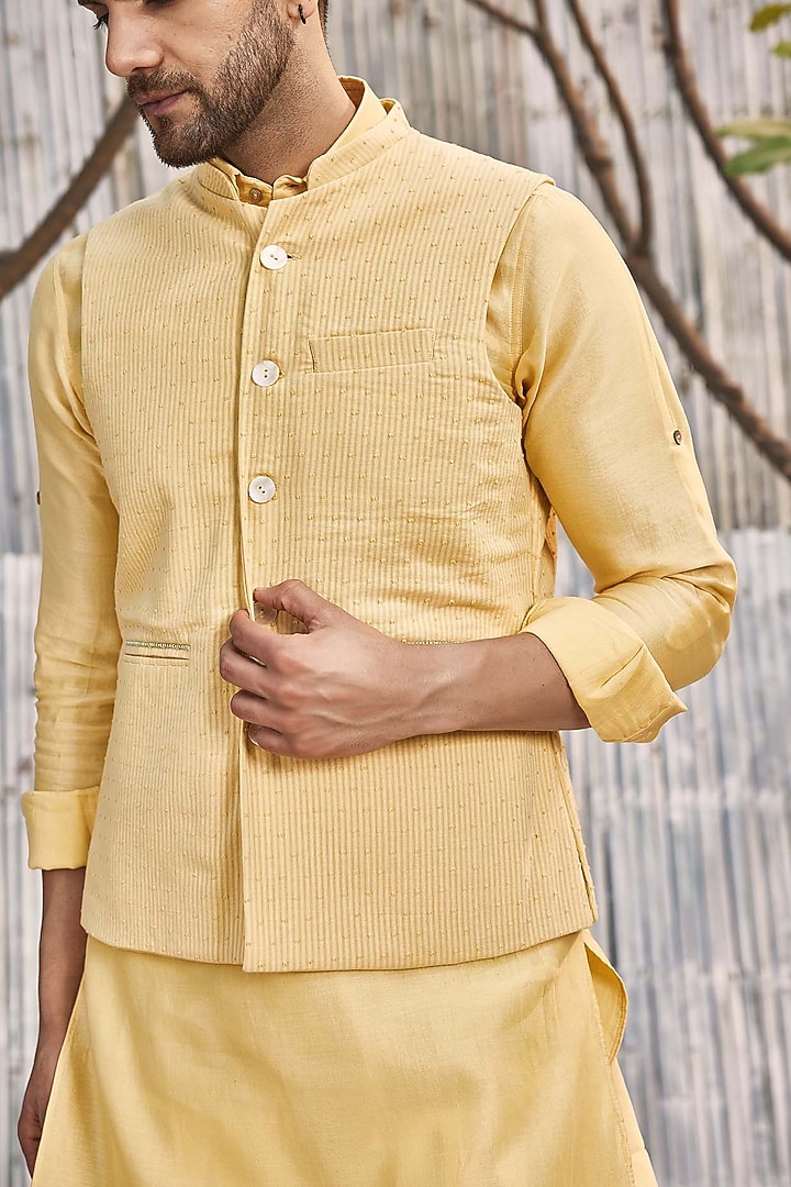 Pastel Yellow Dobby Cotton Bundi Jacket With Kurta Set by Charkhee Men at Pernia's Pop Up Shop