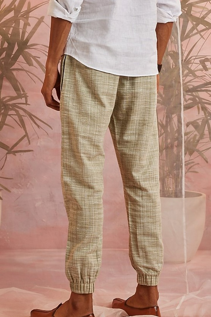Olive Green Textured Cotton Joggers by Charkhee Men at Pernia's Pop Up Shop