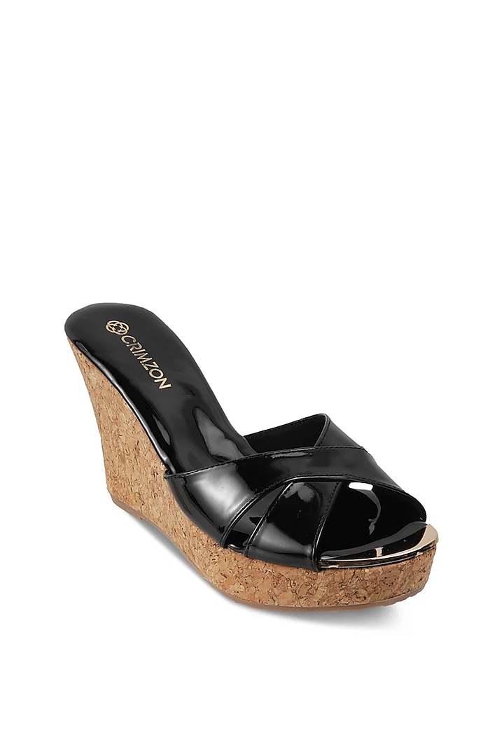 Black Faux Leather Embellished Slip-On Wedges by Crimzon at Pernia's Pop Up Shop